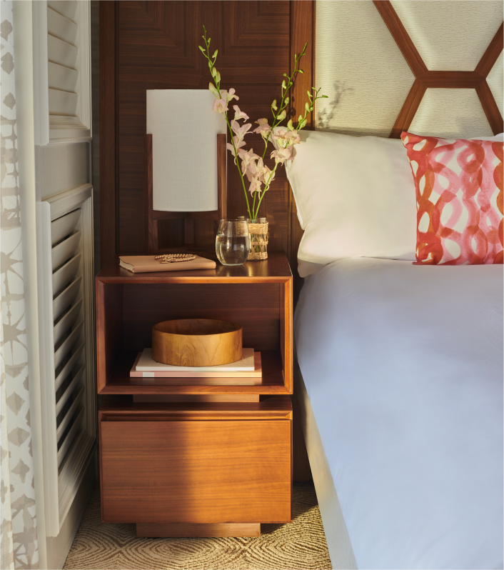 Bedside table with flowers on top