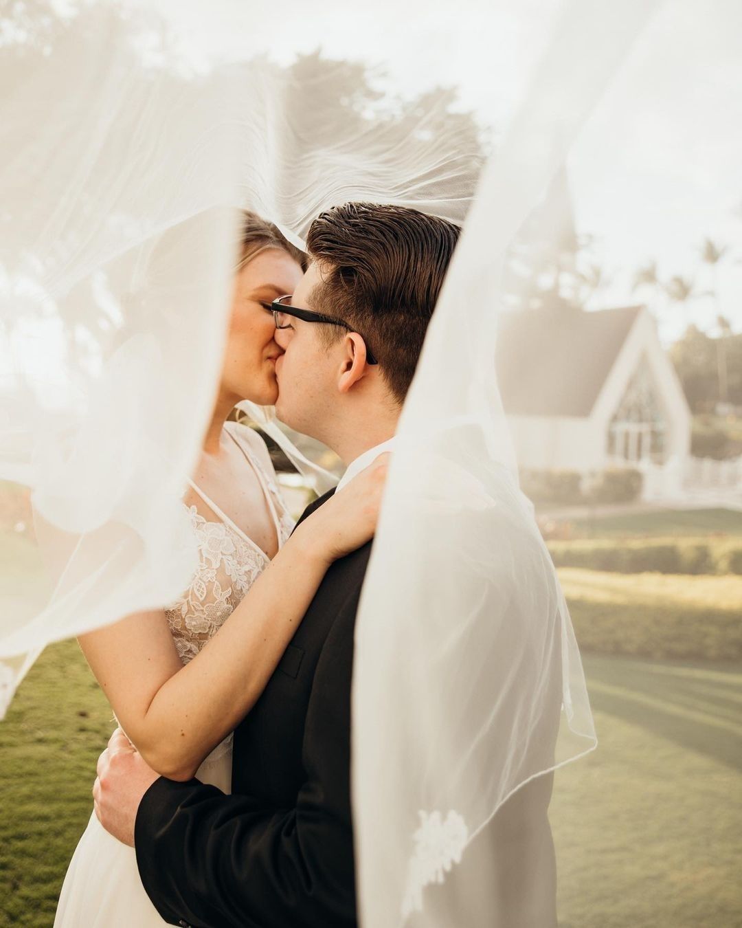 A bride and groom kissing