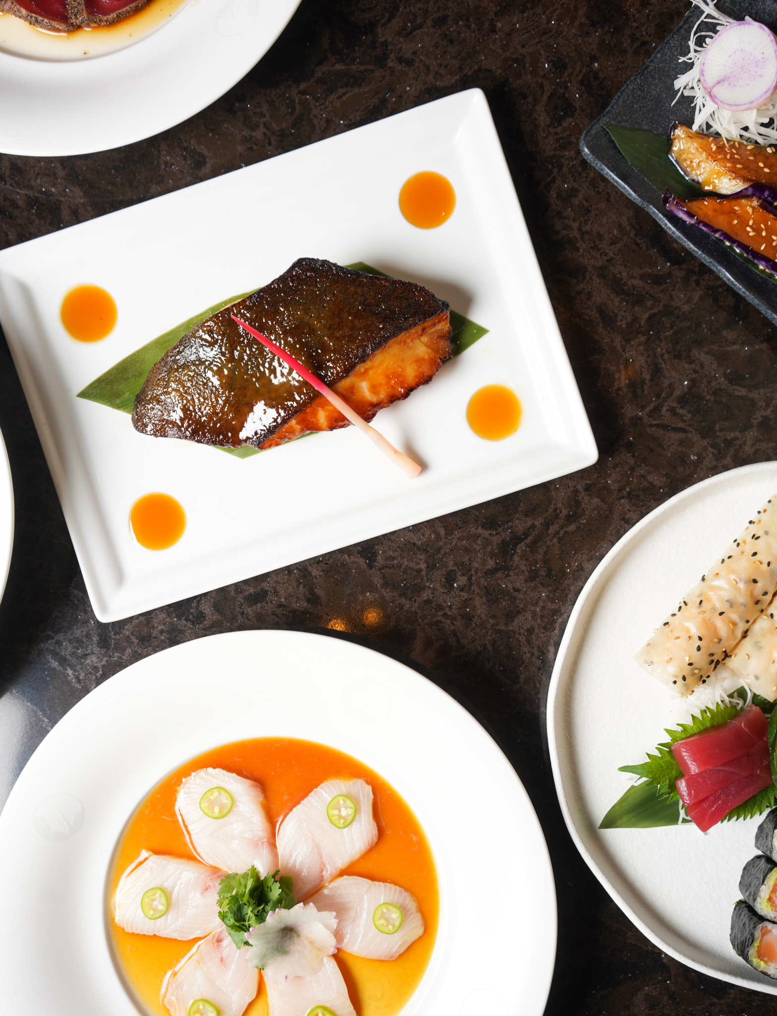 Image of a table with many colourful and delicious dishes