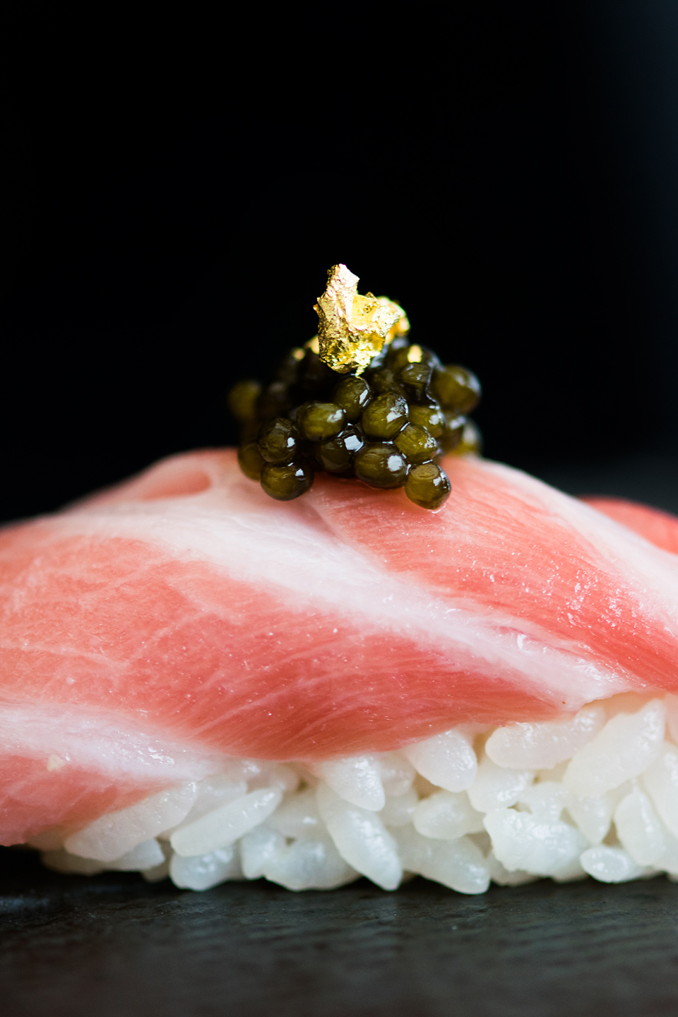 Picture of a piece of sushi with caviar 