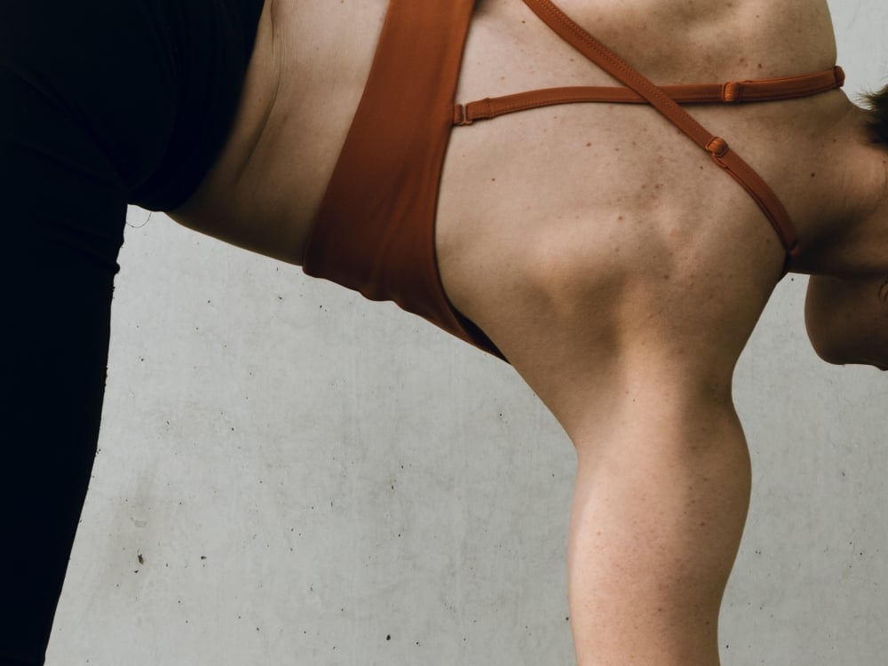 Toned woman in exercising clothing performing a yoga pose