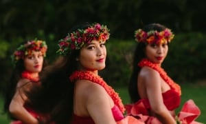 Luau dancers posing at dusk