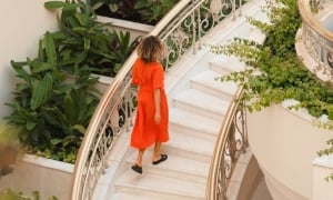 A woman climbing spiral stairs 