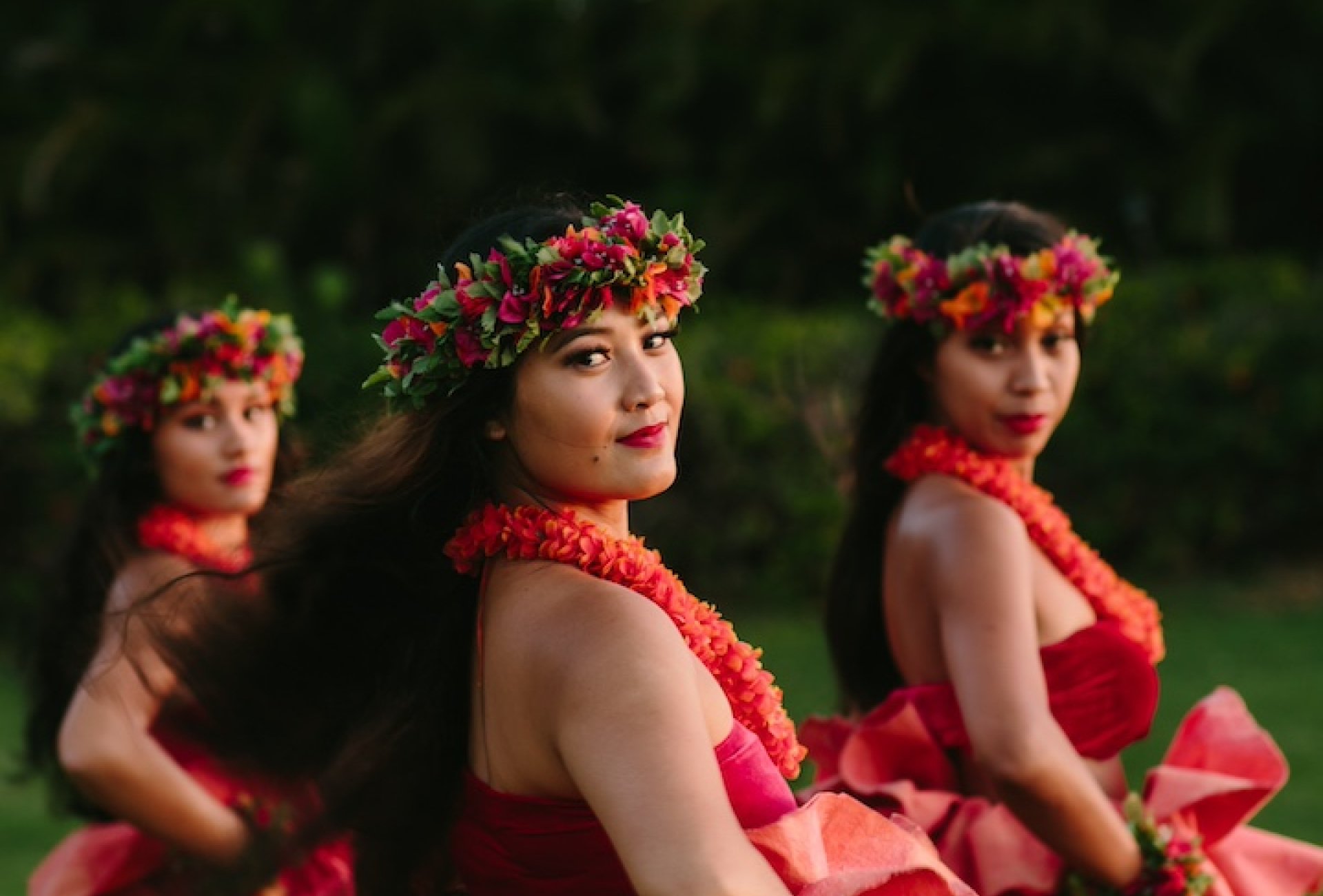 Luau dancers posing at dusk