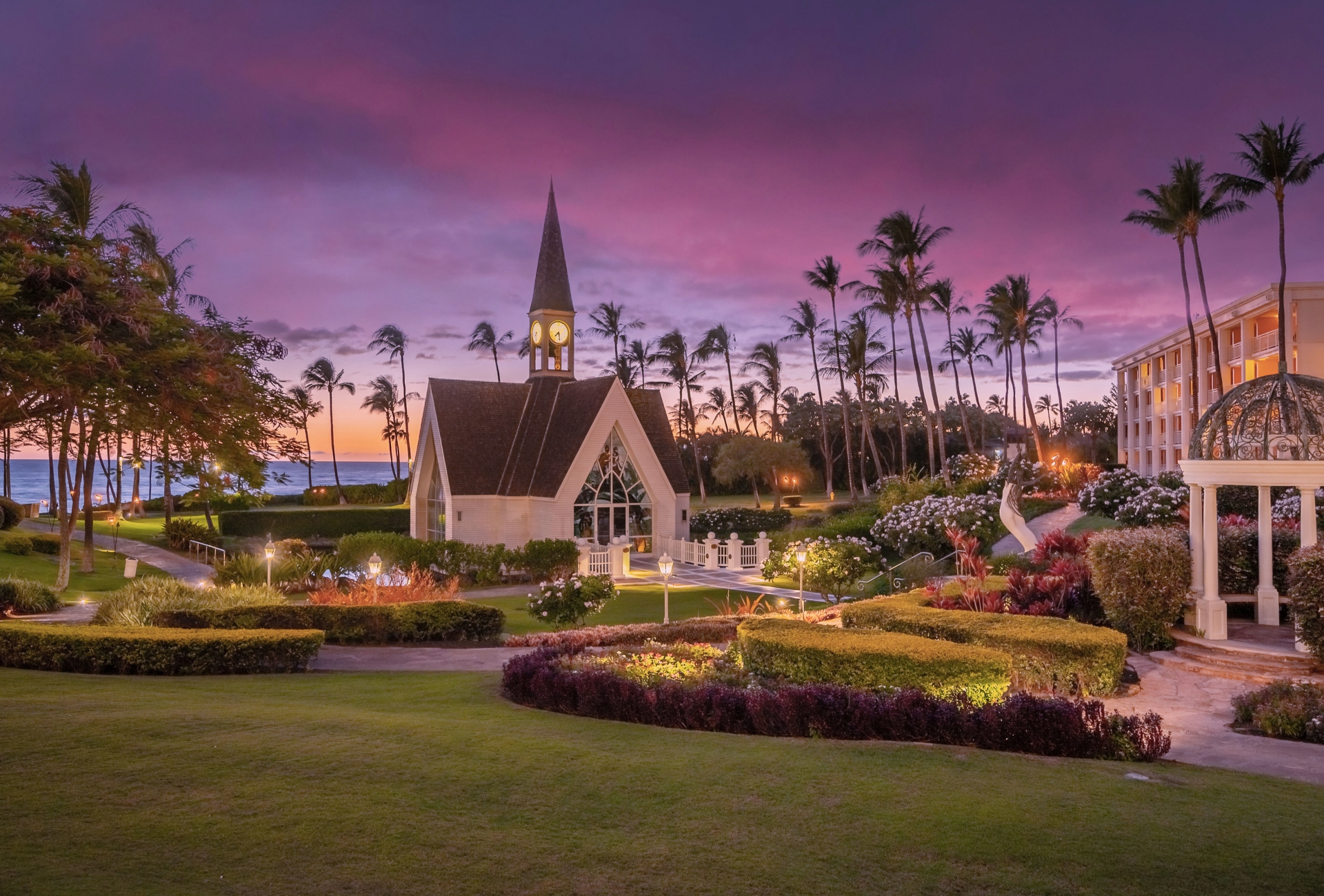 An image of a chapel with a beautiful purplish pink sunset in the background 